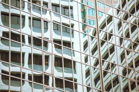 The building reflection in the windows of another building in Hong Kong. 