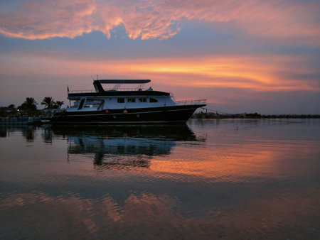A small ship at sunset in Hurghada, Egyptの写真素材