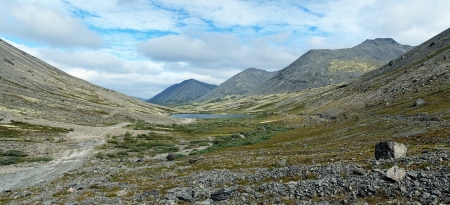 Panorama of Khibiny Mountains with Serdcevidnoe Lake  Heart-shaped Lake , Kuelporr Mount, Marchenko Peak and unnamed peak, Kola Peninsula, Russiaの写真素材