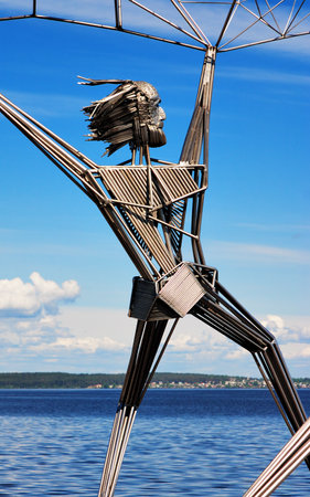 Fisher with the fishnet - fragment of sculpture on the embankment of Lake Onega in Petrozavodsk, Russiaのeditorial素材
