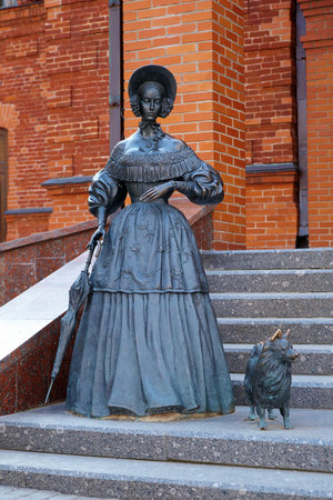 Sculpture of a Lady with a small dog on the steps of Dramatic Theater in Mogilev, Belarusのeditorial素材