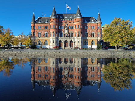 View on Allehandaborgen from Svartan river in Orebro, Sweden  The building originally built in 1891 for Orebro Sparbank and since 1934 it is the office of the local newspaper Nerikes Allehanda のeditorial素材