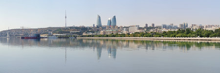 Panorama of Baku downtown with Flame Towers skyscrapers and TV tower from Caspian Sea, Azerbaijanのeditorial素材
