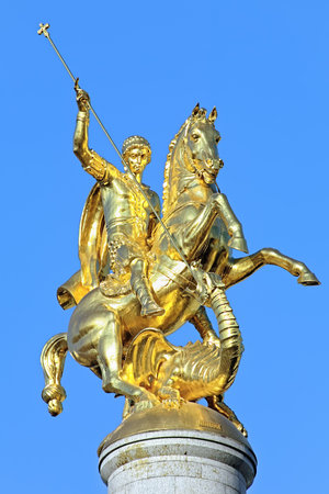 Sculpture of St George slaying the dragon on the top of Freedom Monument on Freedom Square in Tbilisi, Georgiaのeditorial素材