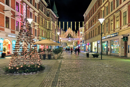 MALMO, SWEDEN - DECEMBER 13, 2015: Sodra Forstadsgatan street with Christmas illumination in the evening. Since 1990 the street became the pedestrian with many shops, cafe and restaurants.のeditorial素材