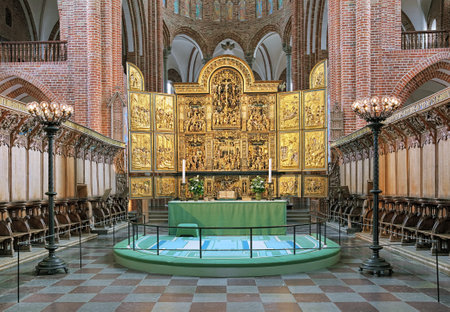 ROSKILDE, DENMARK - DECEMBER 14, 2015: High altar of Roskilde Cathedral. Since the Protestant Reformation in 16th century all Danish kings and almost all queens have been buried in Roskilde Cathedral.のeditorial素材