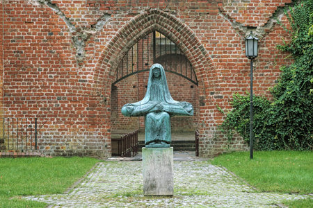 STRALSUND, GERMANY - OCTOBER 27, 2016: Enlarged bronze copy of Ernst Barlach's sculpture The Pieta of 1932. The copy by Hans-Peter Jaeger was erected in 1988 on 50th anniversary of Barlach's death.のeditorial素材