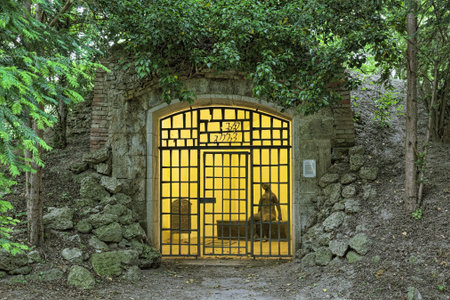 MUNICH, GERMANY - MAY 30, 2017: Grotto with Heinrich Heine Fountain in Dichtergarten. The grotto with sitting female figure by Toni Stadler (1957/58) and a floor fountain was unveiled in August 1962.のeditorial素材