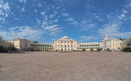 PAVLOVSK, SAINT PETERSBURG, RUSSIA - JUNE 2, 2018: Panoramic view of Pavlovsk Palace, the 18th-century Russian Imperial residence built for Emperor Paul I of Russia, whose statue stands in courtyard.のeditorial素材