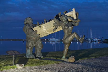 KURESSAARE, ESTONIA - JUNE 23, 2017: Toell the Great and his wife Piret got good catch. The sculpture of characters of Estonian folk mythology on Saaremaa island was created by Tauno Kangro in 2002.のeditorial素材