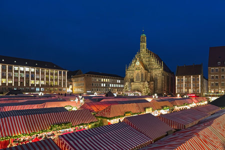 NUREMBERG, GERMANY - DECEMBER 13, 2017: Christkindlesmarkt at Hauptmarkt (Main Market Square) in dusk. This is one of the largest Christmas markets in Germany and one of the most famous in the world.のeditorial素材