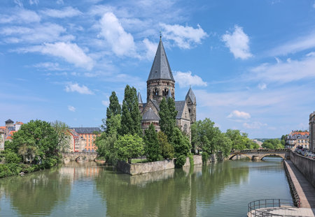 Temple Neuf (New Temple), a Protestant city church in Metz, France. View from a bridge across the Moselle river. The church was built in 1901-1904 by design of the German architect Conrad Wahn.の写真素材