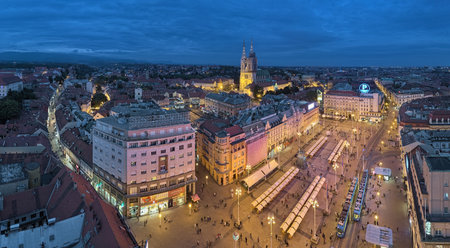 ZAGREB, CROATIA - OCTOBER 7, 2018: Panoramic view of the historical part of the city with Zagreb Cathedral at the Upper Town and Ban Jelacic Square at the Lower Town in dusk.のeditorial素材