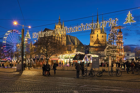 ERFURT, GERMANY - DECEMBER 13, 2018: Christmas market at Domplatz on the background of St Mary's Cathedral and Church of St Severus in twilight. This is one of the largest Christmas market in Germany.のeditorial素材