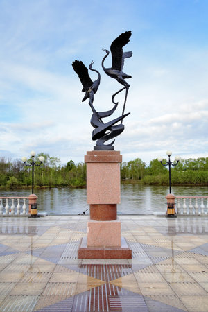 BIROBIDZHAN, RUSSIA â MAY 21, 2011: Sculpture of Siberian Cranes at the embankment of Bira river. The embankment was built in 2009 to commemorate the 75th anniversary of Jewish Autonomous Oblast.のeditorial素材