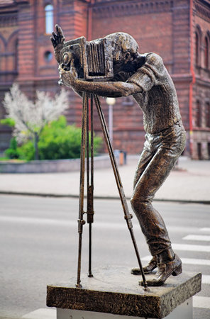 KRASNOYARSK, RUSSIA - AUGUST 6, 2008: Sculpture of a modern photographer with retro large format camera. The sculpture by sculptor Andrey Kiyanitsyn was unveiled on September 2, 2003.のeditorial素材