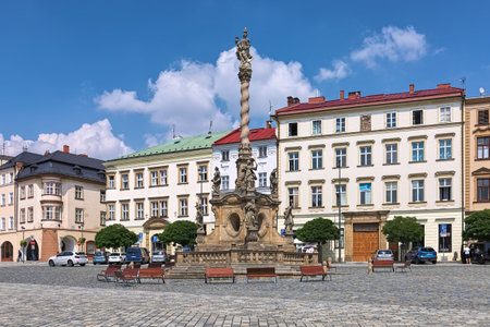 OLOMOUC, CZECH REPUBLIC - JULY 31, 2019: Marian Column on Lower Square. The baroque plague column with statue of Virgin Mary at the top and sculptures of saints was built in 1715-1723.のeditorial素材