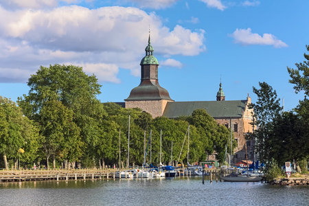 VADSTENA, SWEDEN - AUGUST 25, 2013: Vadstena Castle, view on the main castle building from guest harbor. Construction of the castle was started in 1545. It was completed in 1620.のeditorial素材