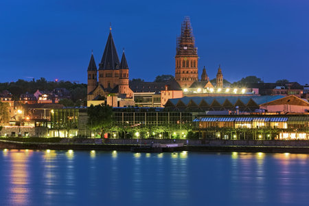 Mainz, Germany. Mainz Cathedral or St. Martin's Cathedral in dusk. View from opposite bank of the Rhine. The cathedral was founded in 975-976.の写真素材