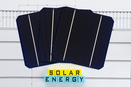 Words solar energy written on yellow and light blue wooden blocks in a conceptual image of...