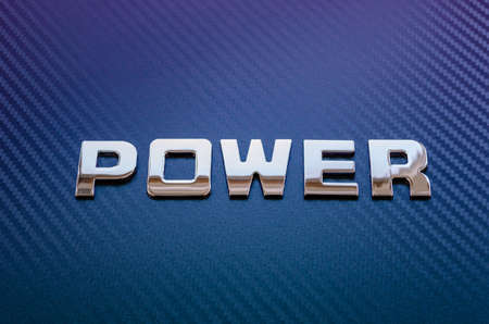Concept of motor sport, speed, engine power. Letters on carbon fiber backgroundの写真素材