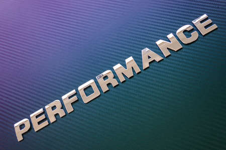 Concept of engine performance. Letters placed diagonally on carbon fibre backgroundの写真素材
