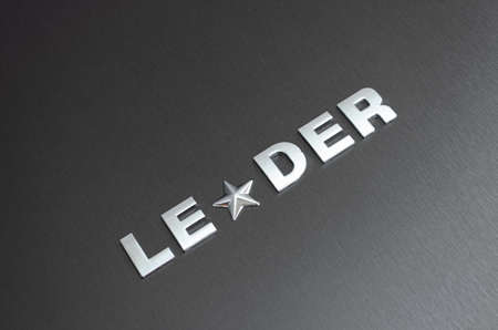 Leader concept, word leader spelled with chrome letters, with star replacing the letter aの写真素材