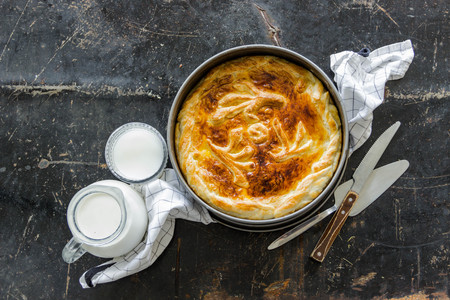 Homemade pie covered with apples, cinnamon,nuts Copyspaceの写真素材