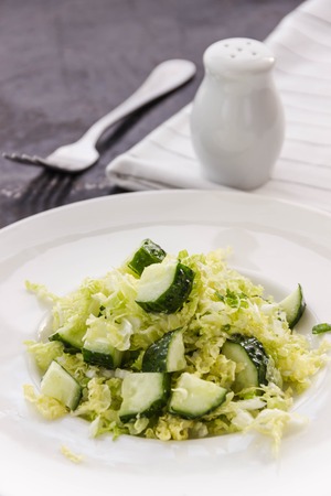 fresh vegetables salad with cabbage and frech cucumberの写真素材