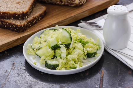 fresh vegetables salad with cabbage and frech cucumberの写真素材