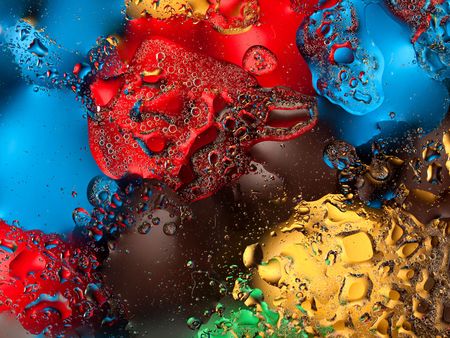 Vivid abstract background with waterdrops in the foreground and different colours in the background.の写真素材