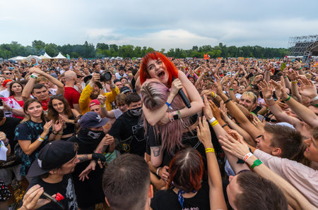 Vocalist of the rock band Kis-kis Sofia Somuseva and drummer Alyona Olesheva sing among the crowd of fans at Fox Rock Festのeditorial素材
