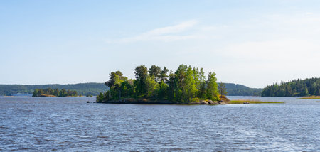 Small rocky islands overgrown with trees on Lake Ladogaの写真素材