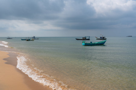 Fishing boats stand off the coast during bad weather in the South Seaの写真素材