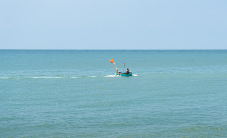 Phu Quoc Island, Vietnam, February 4, 2024 A local fisherman on a round boat sails to a fishing spotの写真素材