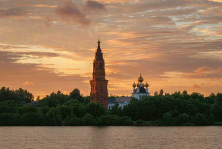 The Church of the Nativity in the village of Priluki, Yaroslavl region, on the banks of the Volga River at sunsetの写真素材