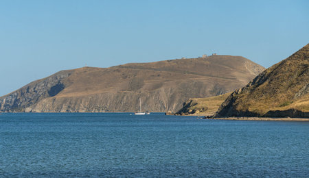 Seascape with yachts and mountains