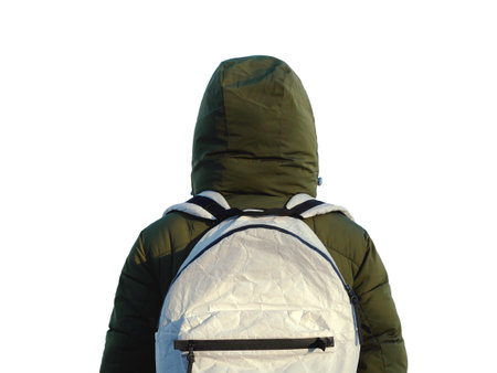 Strange person in the backpack on a white background isolated. Winter travel concept