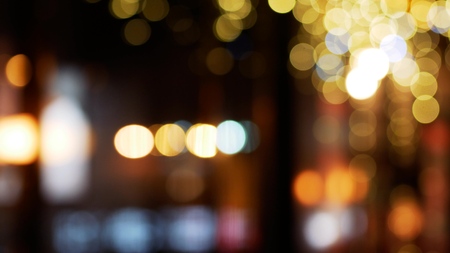 City lights bokeh. Defocused night life background. Out of focusの写真素材