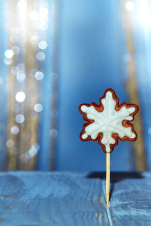 Christmas holidays background copy space for text .Gingerbread in the form of snowflakes.Winter background with blue accent.の写真素材