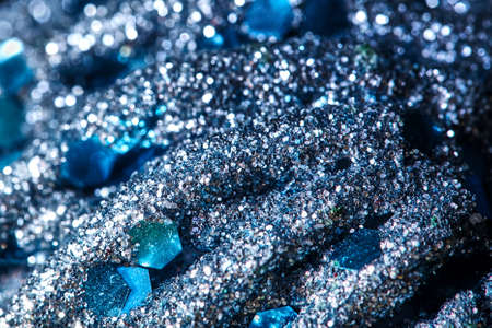 Christmas abstract blue beautiful background. Fragment of a toy in a glitter for a Christmas tree. Christmas background with free space for your text, design, backdrop for postcards.の写真素材