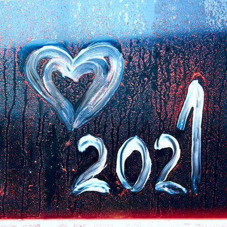 Abstract background new year number 2021. Happy New Year 2021. New 2021 brings up love.Inscription 2021 on glassの写真素材
