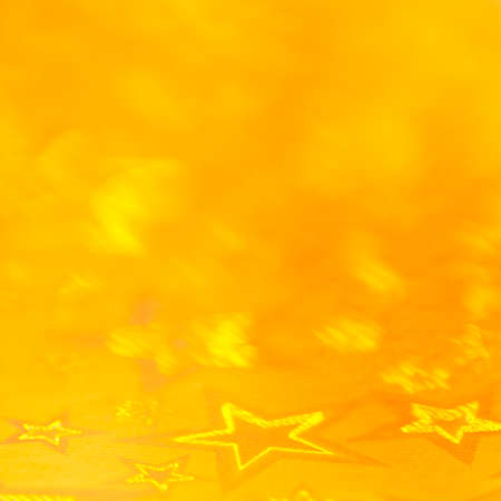 Stars abstract lights, yellow blurred background. Blurred yellow-orange background.の写真素材