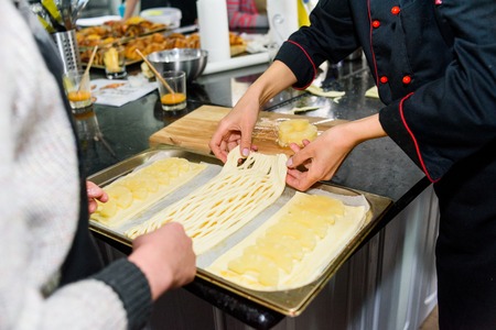 process of cooking dough on the table closeupの写真素材