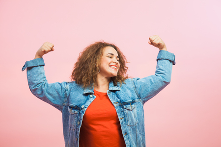 Young woman show power in arms. Female indepence energy and strength conceptの写真素材