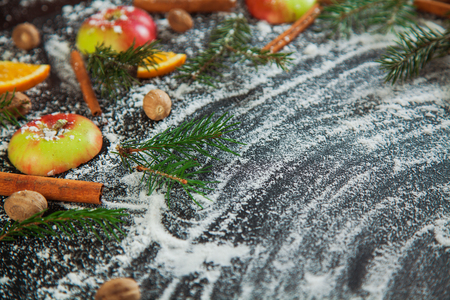 Apple cinamon nutmeg orange snow green fir branches mulled wine concept new year background christmas top view flat lay copy spaceの写真素材