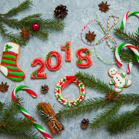 Christmas new year background greeting card gingerbread 2018 caramel fir tree cones cinnamon holiday conceptの写真素材