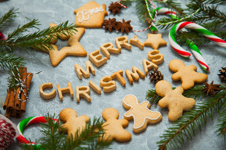 Christmas new year background greeting card gingerbread candy fir tree cones cinnamon holiday conceptの写真素材