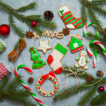 Christmas new year background greeting card gingerbread candy fir tree cones cinnamon holiday conceptの写真素材