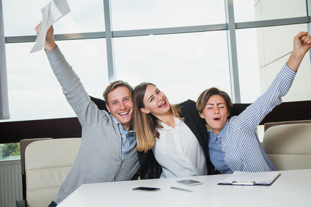 Business team celebrate victory success goal achievement happy smile expression positive emotion, three young students joyful about finishing course workの写真素材